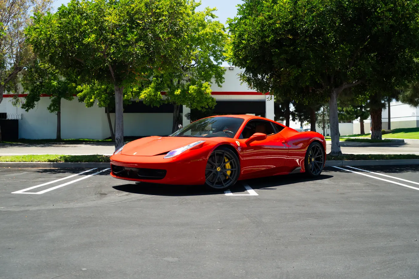 Ferrari 458 Italia in red, one of the two cars compared